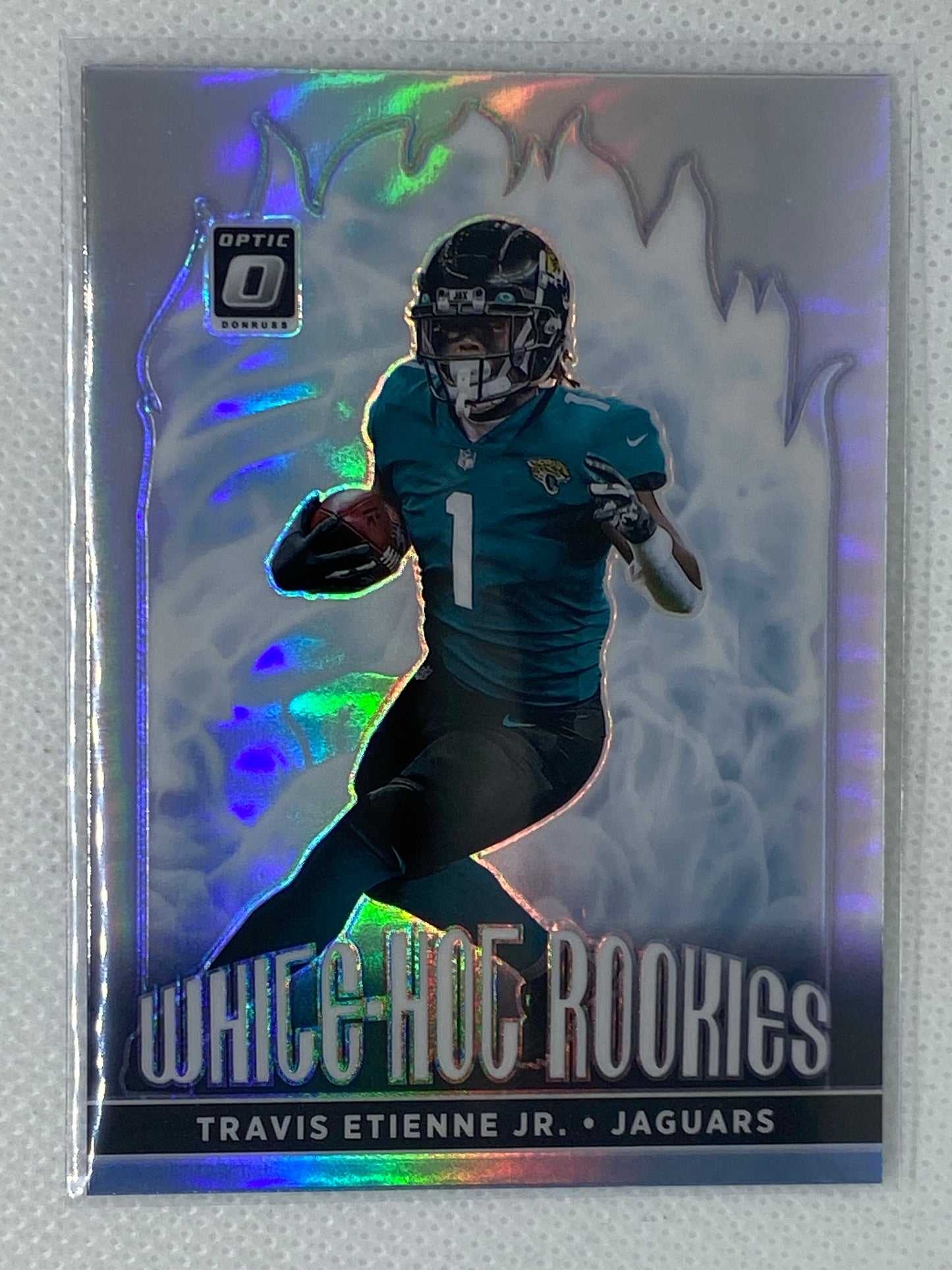 2021 Donruss Optic Travis Etienne Jr Holo Prizm White Hot Rookie RC #WHR-7 Jacksonville Jaguars