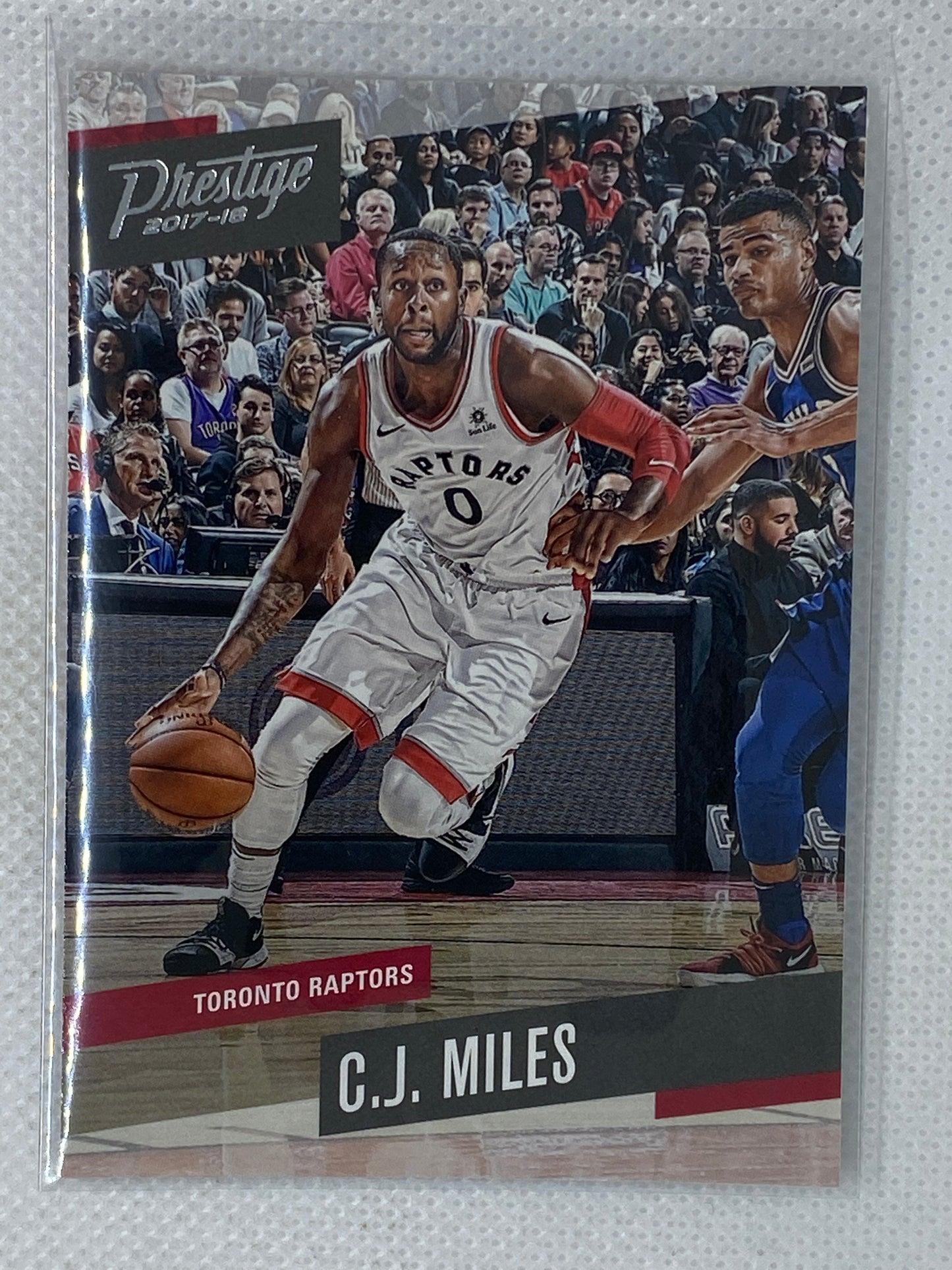 2017-18 Panini Prestige #110 C.J. Miles Toronto Raptors w Drake in Stands